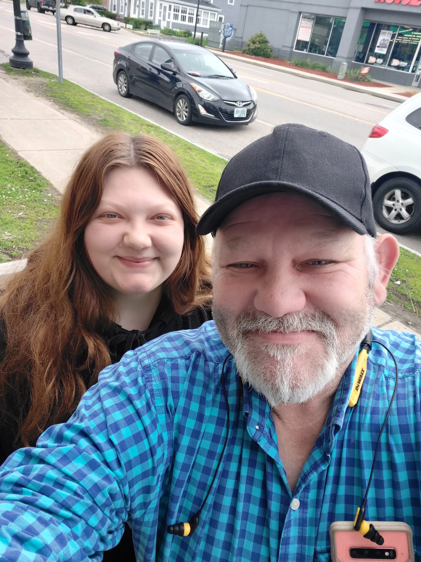 Destiny smiling with a loved one outdoors